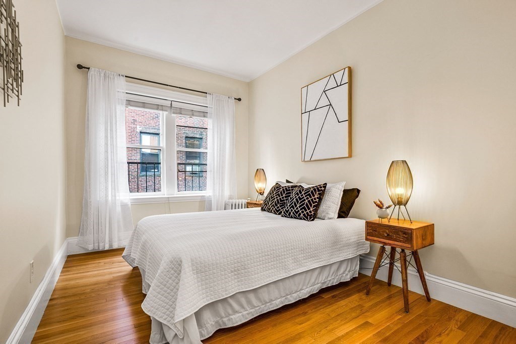 481 Beacon Street, Unit 43 Boston, MA 02115 - Photo 5 of 10 a bedroom with a bed and a window