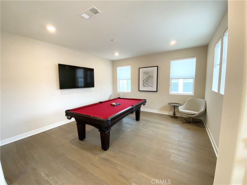 62 Hawking Irvine, CA 92618 - Photo 14 of 37 a living room with furniture pool table and a flat screen tv