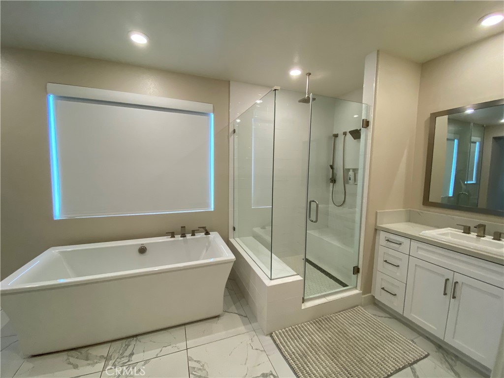 62 Hawking Irvine, CA 92618 - Photo 20 of 37 a spacious bathroom with a tub shower a mirror and a sink