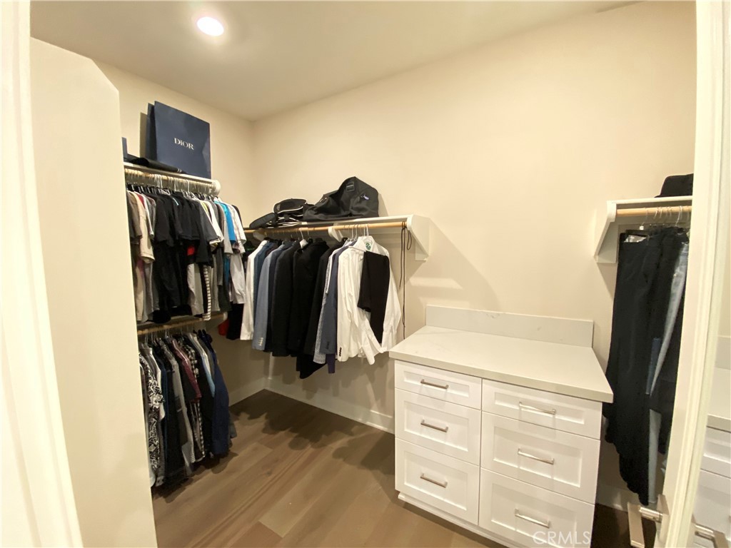 62 Hawking Irvine, CA 92618 - Photo 21 of 37 a view of walk in closet with clothes and shoes