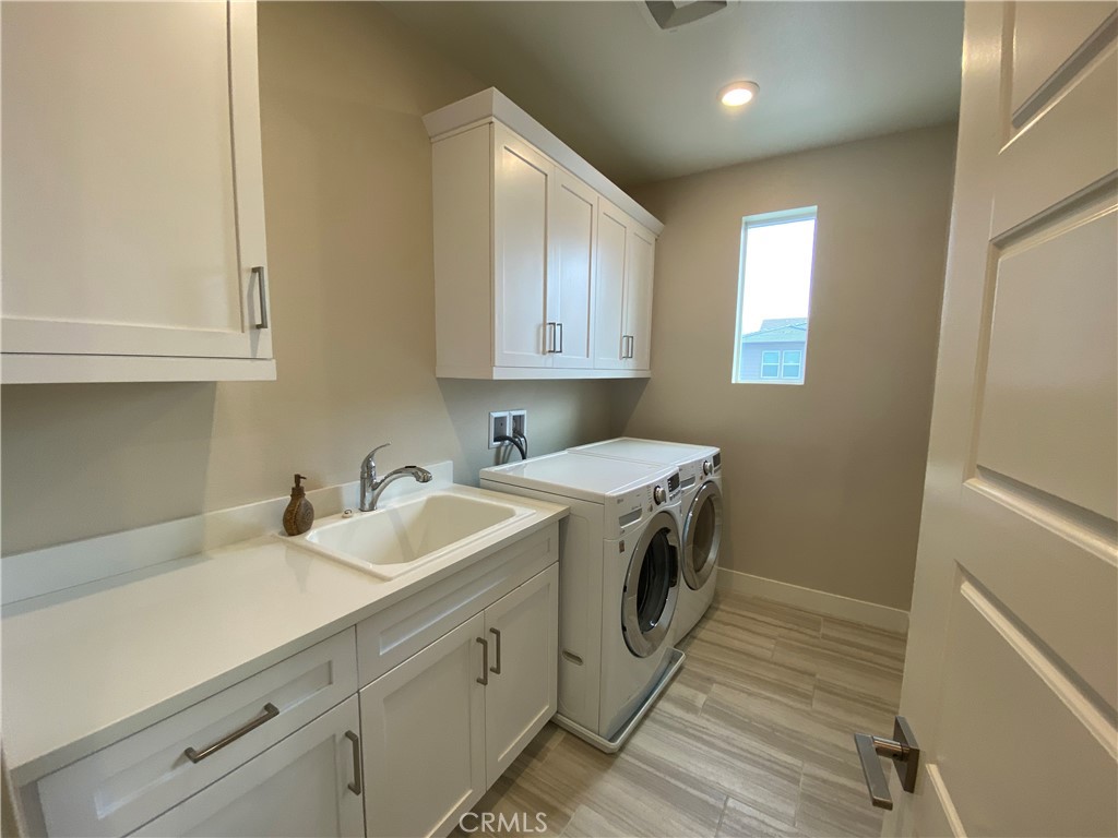 62 Hawking Irvine, CA 92618 - Photo 25 of 37 a view of a sink and dishwasher with wooden floor