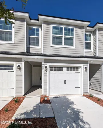 a front view of a house with a garage