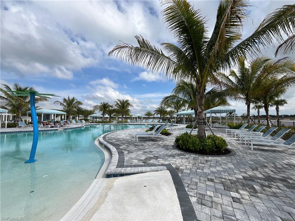 4580 Centaurus Circle Naples, FL 34120 - Photo 20 of 25 Community pool with a patio area
