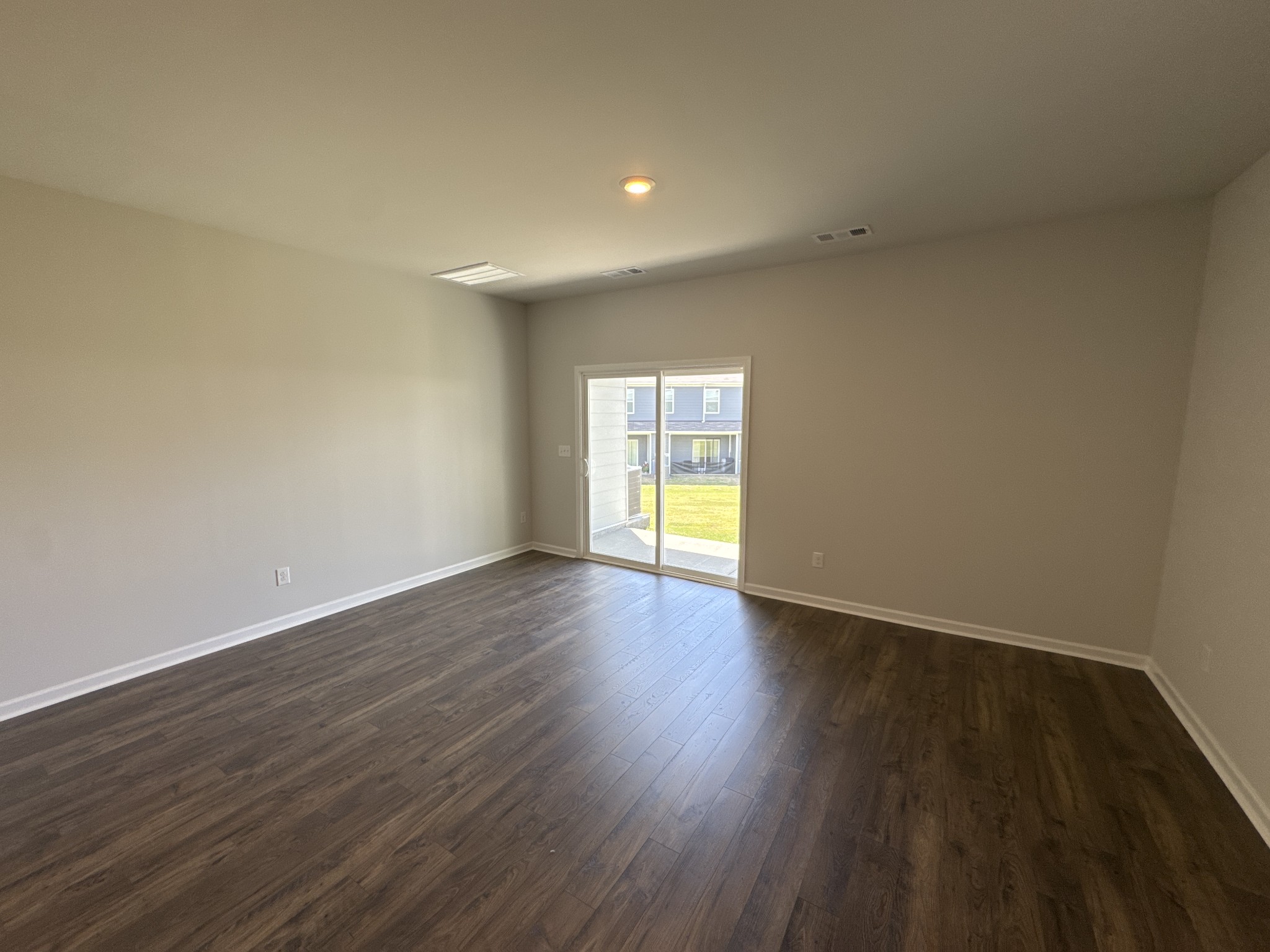 905 Highfield Way Lebanon, TN 37087 - Photo 8 of 15 a view of an empty room with wooden floor and window