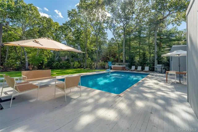 a view of a swimming pool with a yard