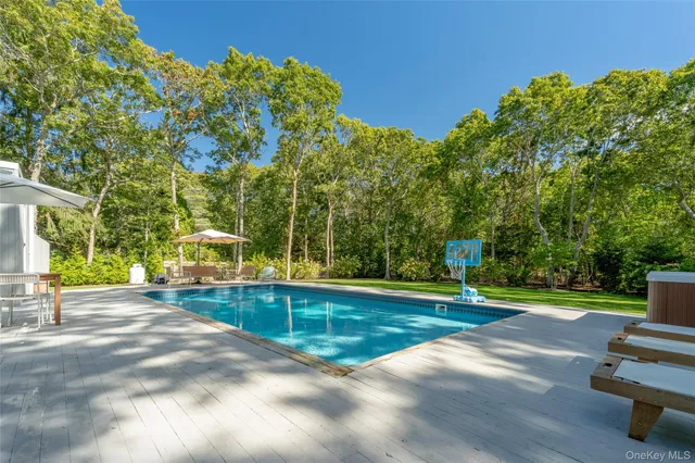 a view of a swimming pool with a patio