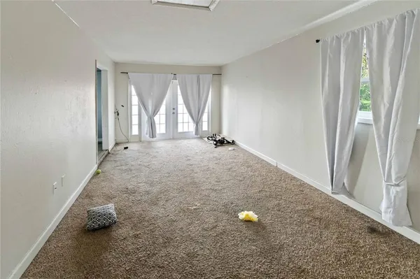a view of an empty room and window
