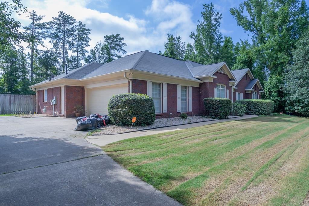 7386 Garrett Road Midland, GA 31820 - Photo 1 of 29 a front view of a house with yard and green space