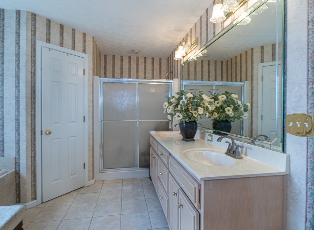 7386 Garrett Road Midland, GA 31820 - Photo 13 of 29 a bathroom with a sink and a mirror