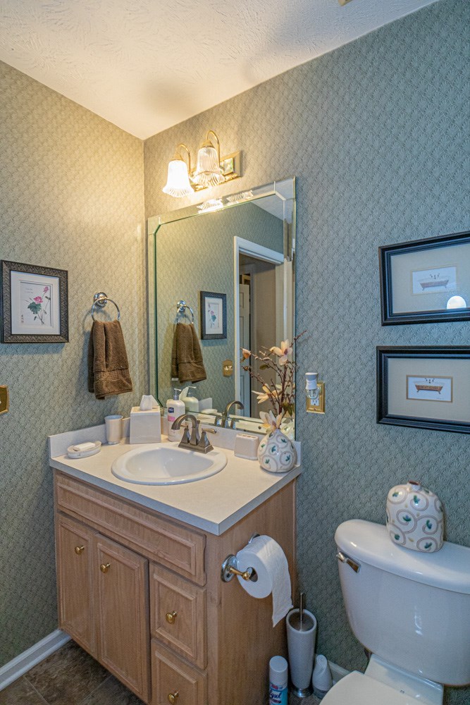7386 Garrett Road Midland, GA 31820 - Photo 20 of 29 a bathroom with a sink double vanity and a mirror