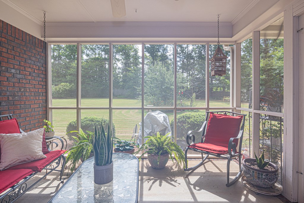 7386 Garrett Road Midland, GA 31820 - Photo 26 of 29 a balcony with furniture and a potted plant