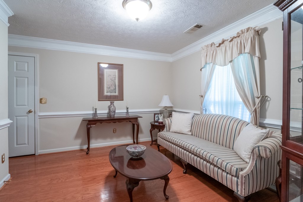 7386 Garrett Road Midland, GA 31820 - Photo 3 of 29 a living room with furniture and a wooden floor
