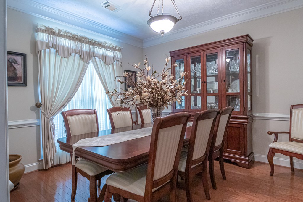 7386 Garrett Road Midland, GA 31820 - Photo 6 of 29 a view of a dining room with furniture window and wooden floor