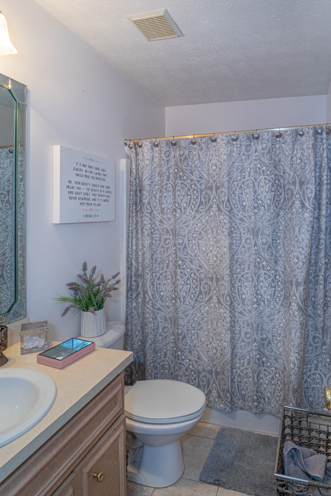 7386 Garrett Road Midland, GA 31820 - Photo 8 of 29 a bathroom with a sink a toilet and shower