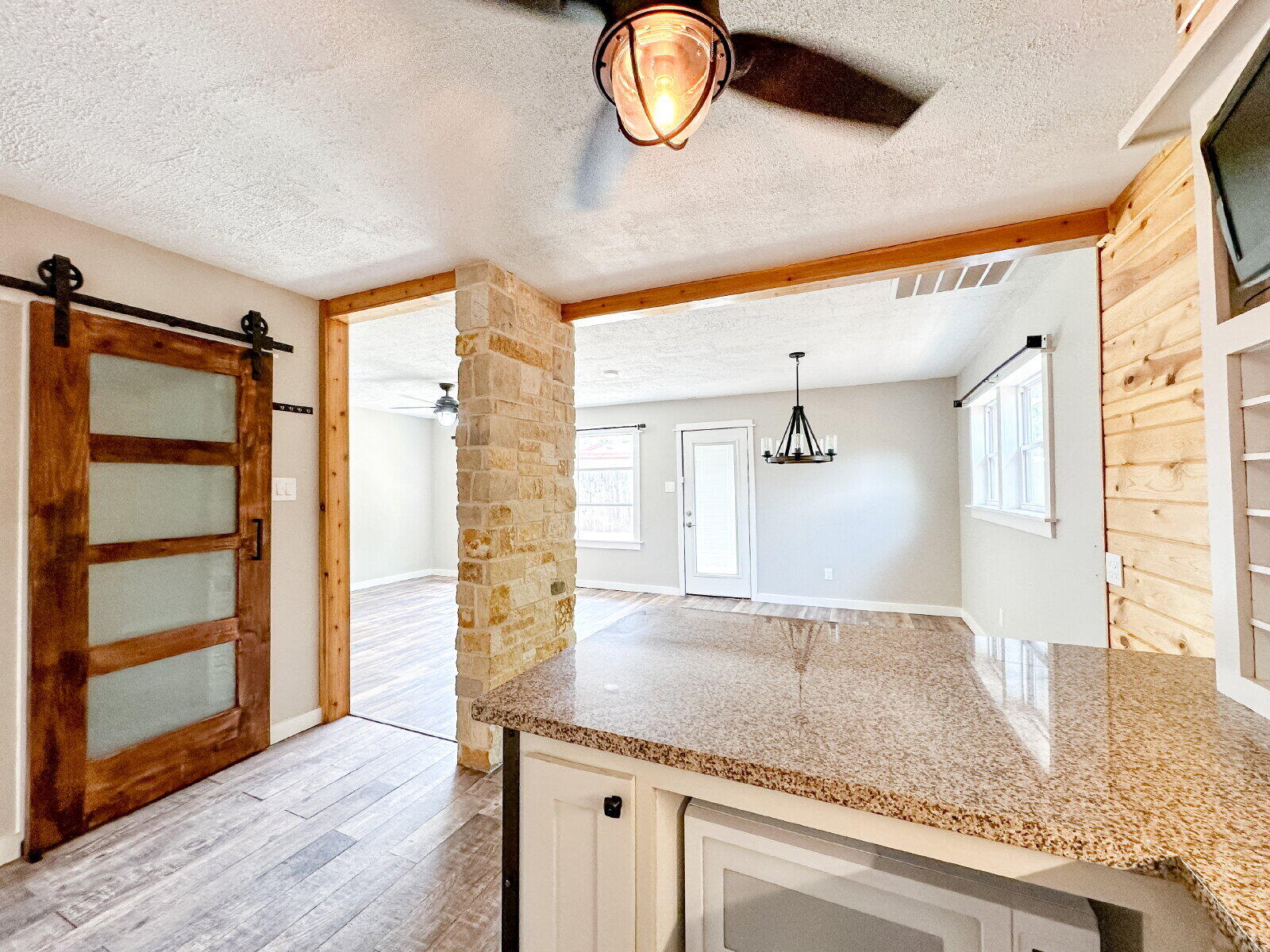 2608 Raleigh Avenue Lubbock, TX 79410 - Photo 16 of 23 a bathroom with a granite countertop sink a mirror and a shower