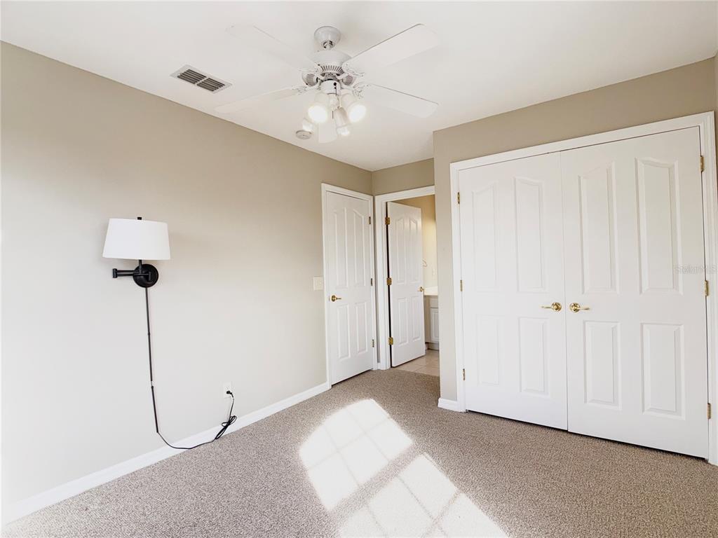 104 Vista Loop Davenport, FL 33897 - Photo 29 of 42 a view of a room with a ceiling fan
