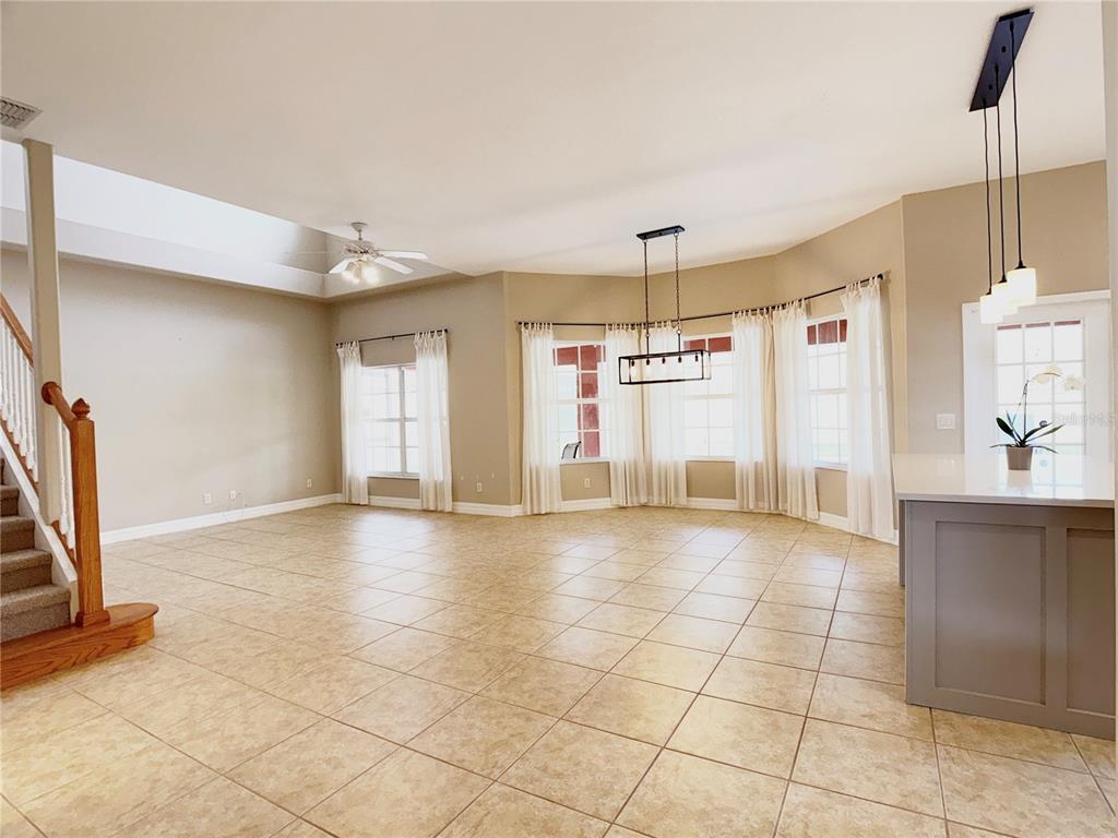 104 Vista Loop Davenport, FL 33897 - Photo 3 of 42 a view of a kitchen with a sink and a window
