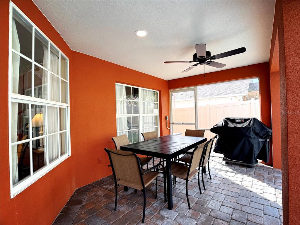 104 Vista Loop Davenport, FL 33897 - Photo 39 of 42 a view of a dining room with furniture window and wooden floor