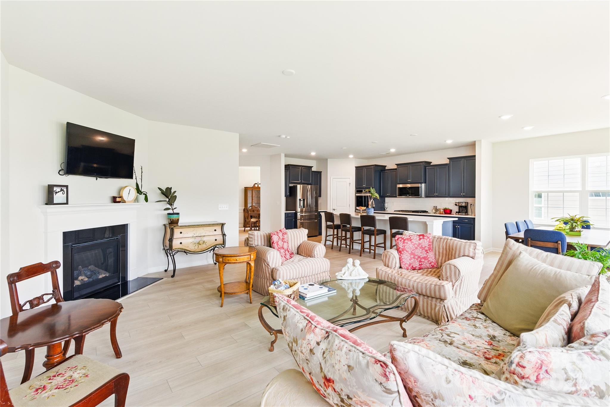 4069 Havenport Circle Tega Cay, SC 29708 - Photo 13 of 48 a living room with fireplace furniture and a flat screen tv