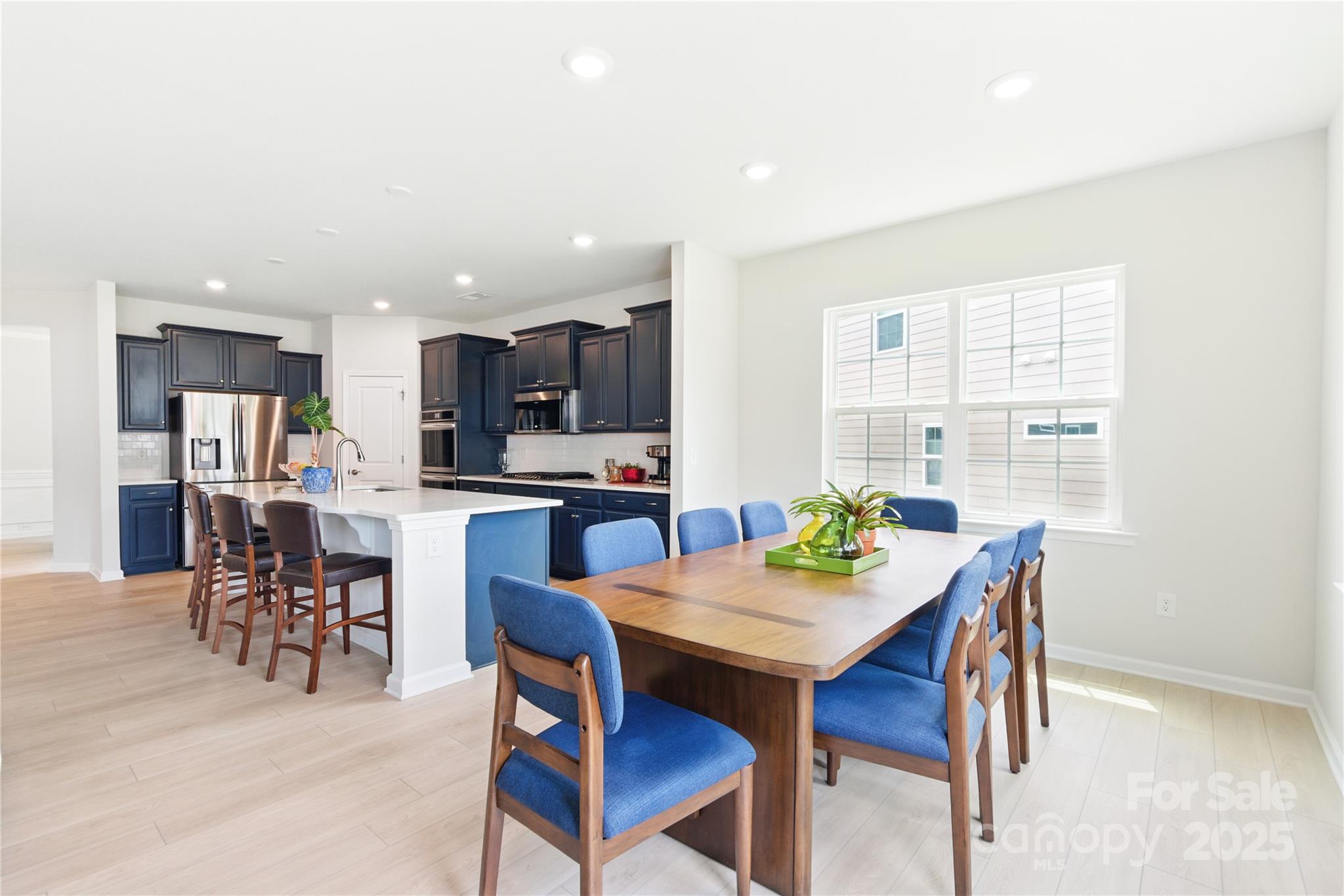 4069 Havenport Circle Tega Cay, SC 29708 - Photo 15 of 48 a view of a dining room with furniture and a kitchen