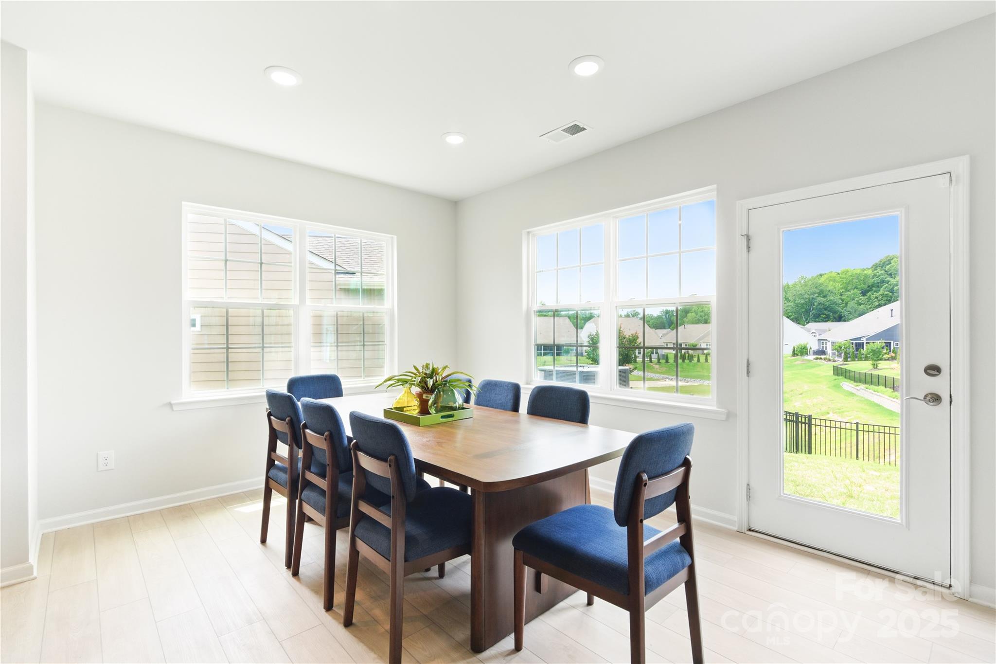 4069 Havenport Circle Tega Cay, SC 29708 - Photo 16 of 48 a view of a dining room with furniture window and outside view