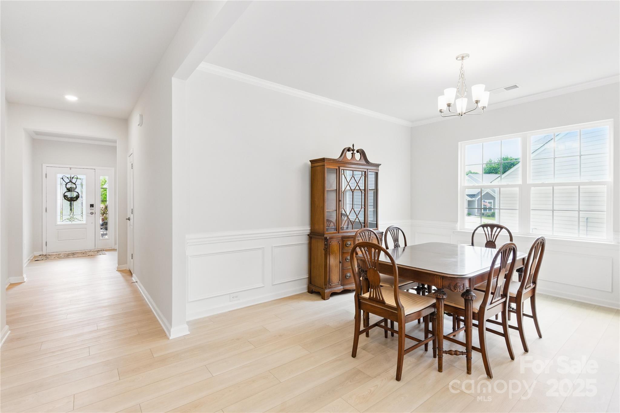 4069 Havenport Circle Tega Cay, SC 29708 - Photo 17 of 48 a view of a dining room with furniture and chandelier
