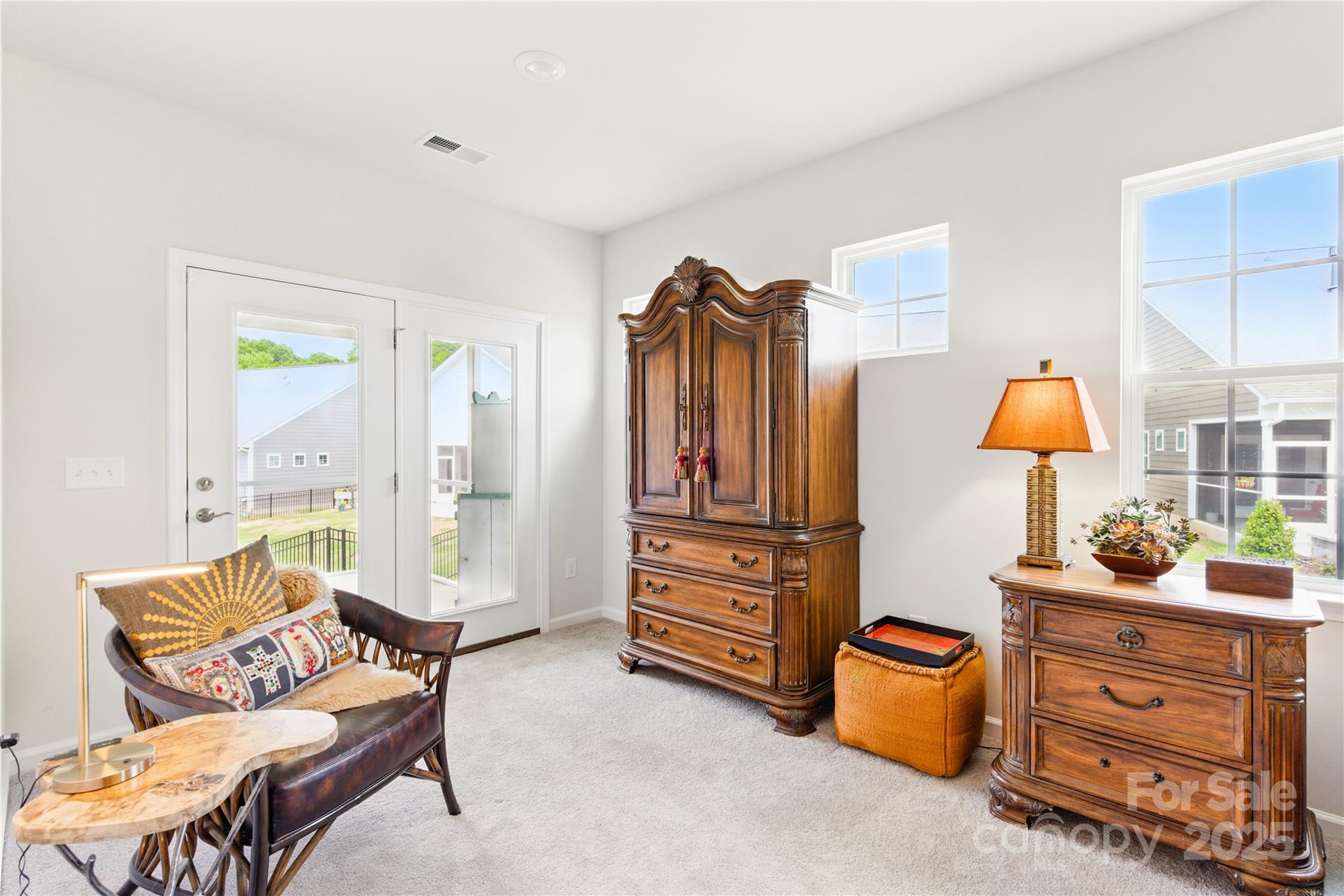 4069 Havenport Circle Tega Cay, SC 29708 - Photo 21 of 48 a living room with furniture a lamp and a window