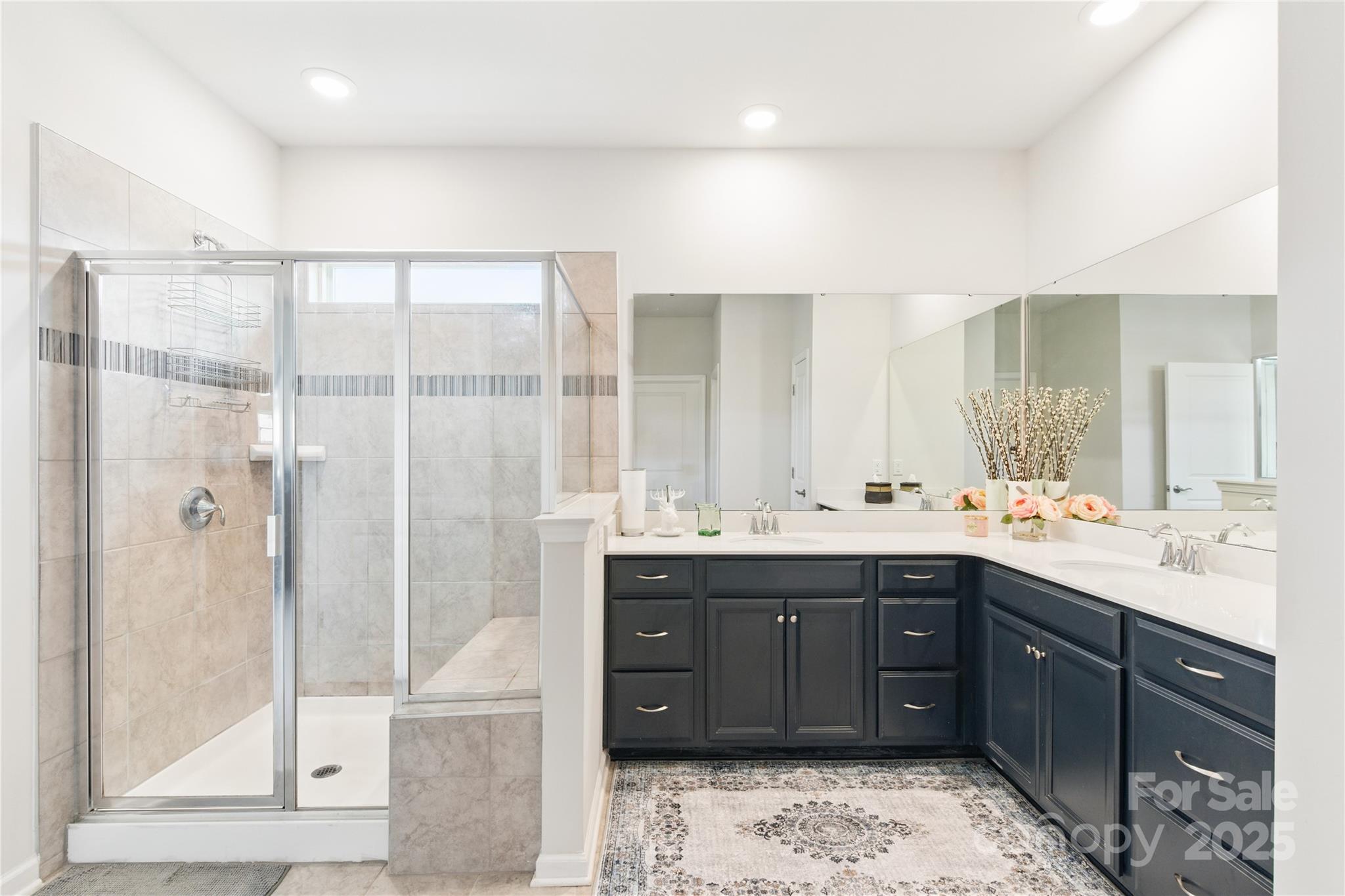 4069 Havenport Circle Tega Cay, SC 29708 - Photo 24 of 48 a bathroom with a double vanity sink mirror and shower