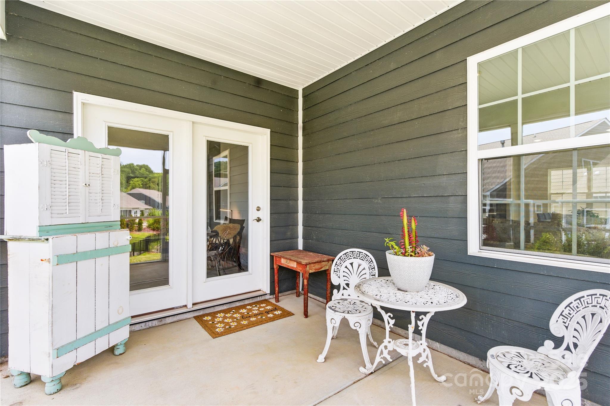 4069 Havenport Circle Tega Cay, SC 29708 - Photo 27 of 48 a patio with table and chairs and potted plants
