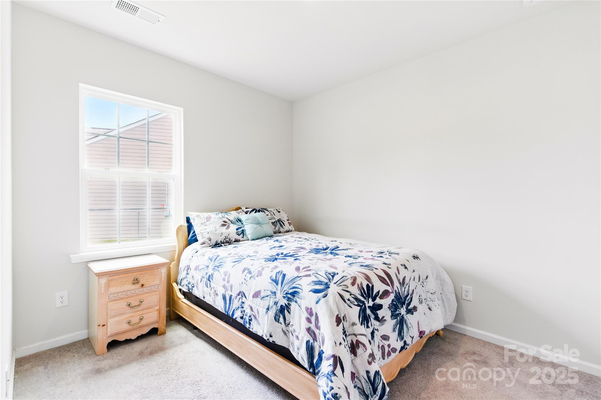 4069 Havenport Circle Tega Cay, SC 29708 - Photo 30 of 48 a bedroom with a bed and window