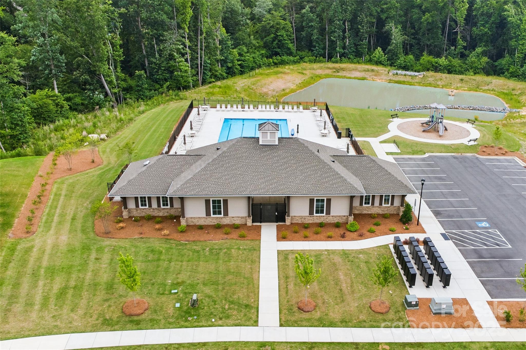 4069 Havenport Circle Tega Cay, SC 29708 - Photo 45 of 48 a view of swimming pool and trees in the background
