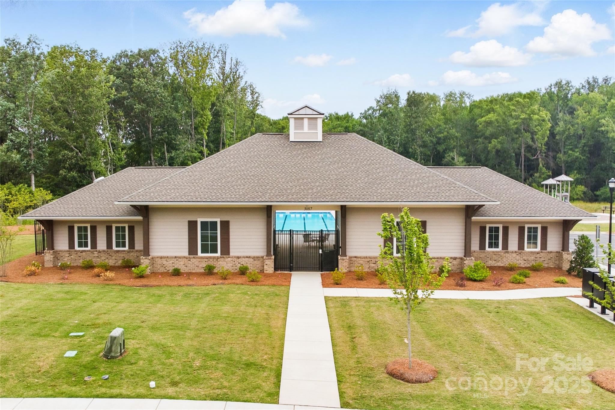 4069 Havenport Circle Tega Cay, SC 29708 - Photo 46 of 48 a front view of a house with swimming pool having outdoor seating