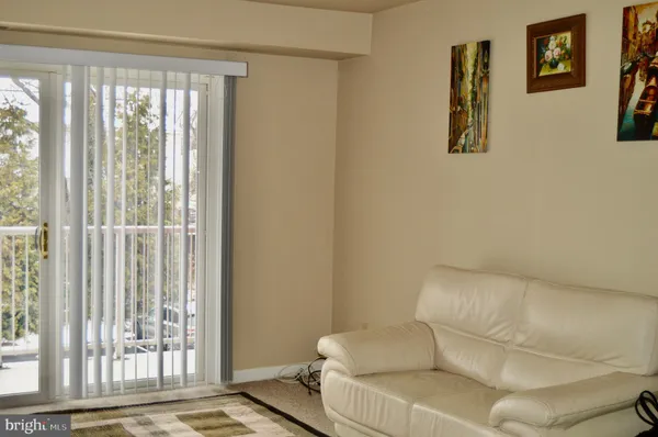 a bedroom with a bed and a ceiling fan