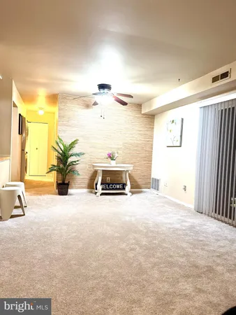 a view of a livingroom with wooden floor
