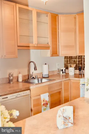 a view of staircase with railing and white walls