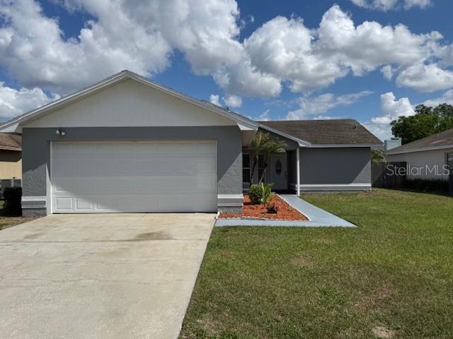 3407 Fox Ridge Street Winter Haven, FL 33884 - Photo 1 of 16 a front view of house with yard and porch