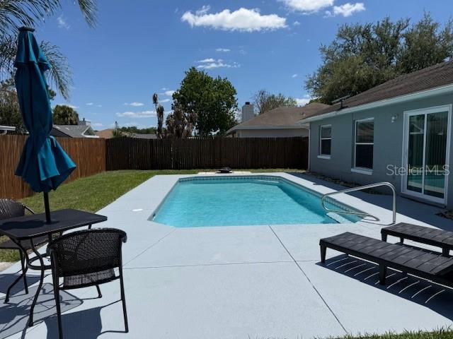 3407 Fox Ridge Street Winter Haven, FL 33884 - Photo 15 of 16 a view of a backyard with sitting area