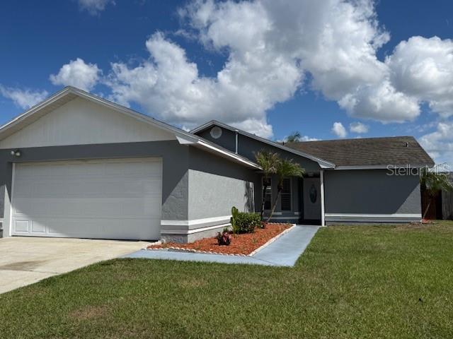 3407 Fox Ridge Street Winter Haven, FL 33884 - Photo 2 of 16 a front view of house with yard and entertaining space