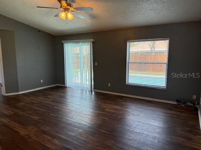 3407 Fox Ridge Street Winter Haven, FL 33884 - Photo 3 of 16 a view of an empty room with wooden floor and a window