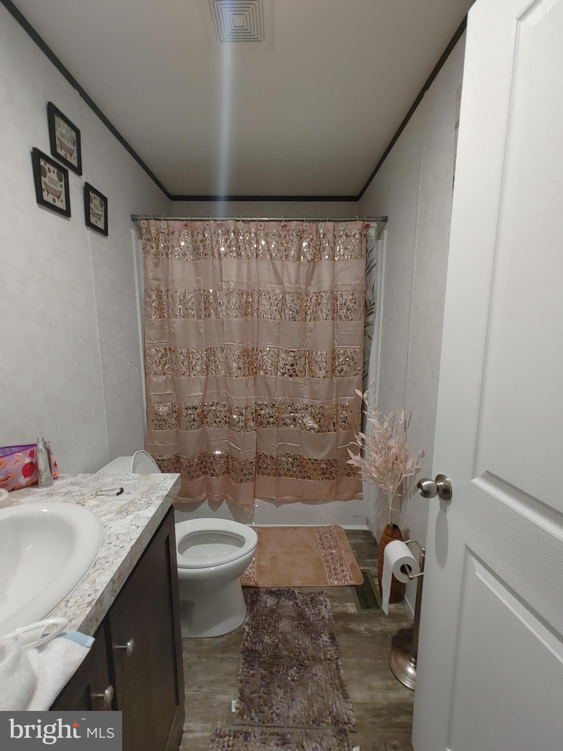 1446 Gibson Road, Unit D50 Bensalem, PA 19020 - Photo 4 of 8 a bathroom with a sink toilet and shower