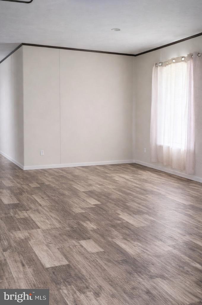 1446 Gibson Road, Unit D50 Bensalem, PA 19020 - Photo 5 of 8 a view of an empty room with a window