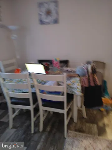 a view of a dining room with furniture and a table