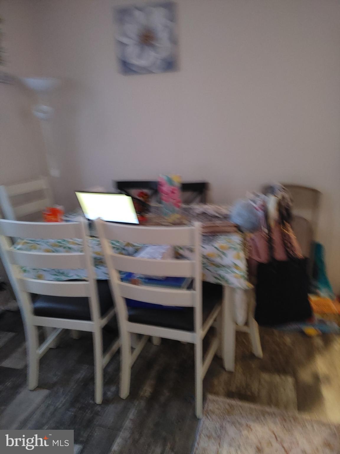 1446 Gibson Road, Unit D50 Bensalem, PA 19020 - Photo 6 of 8 a view of a dining room with furniture and a table