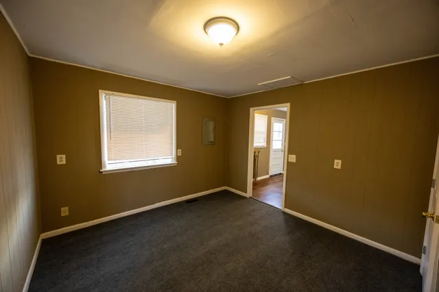 an empty room with a empty space and windows