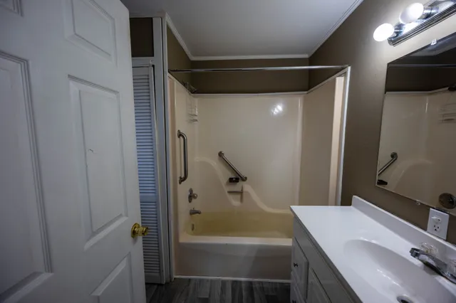 a bathroom with a sink and shower