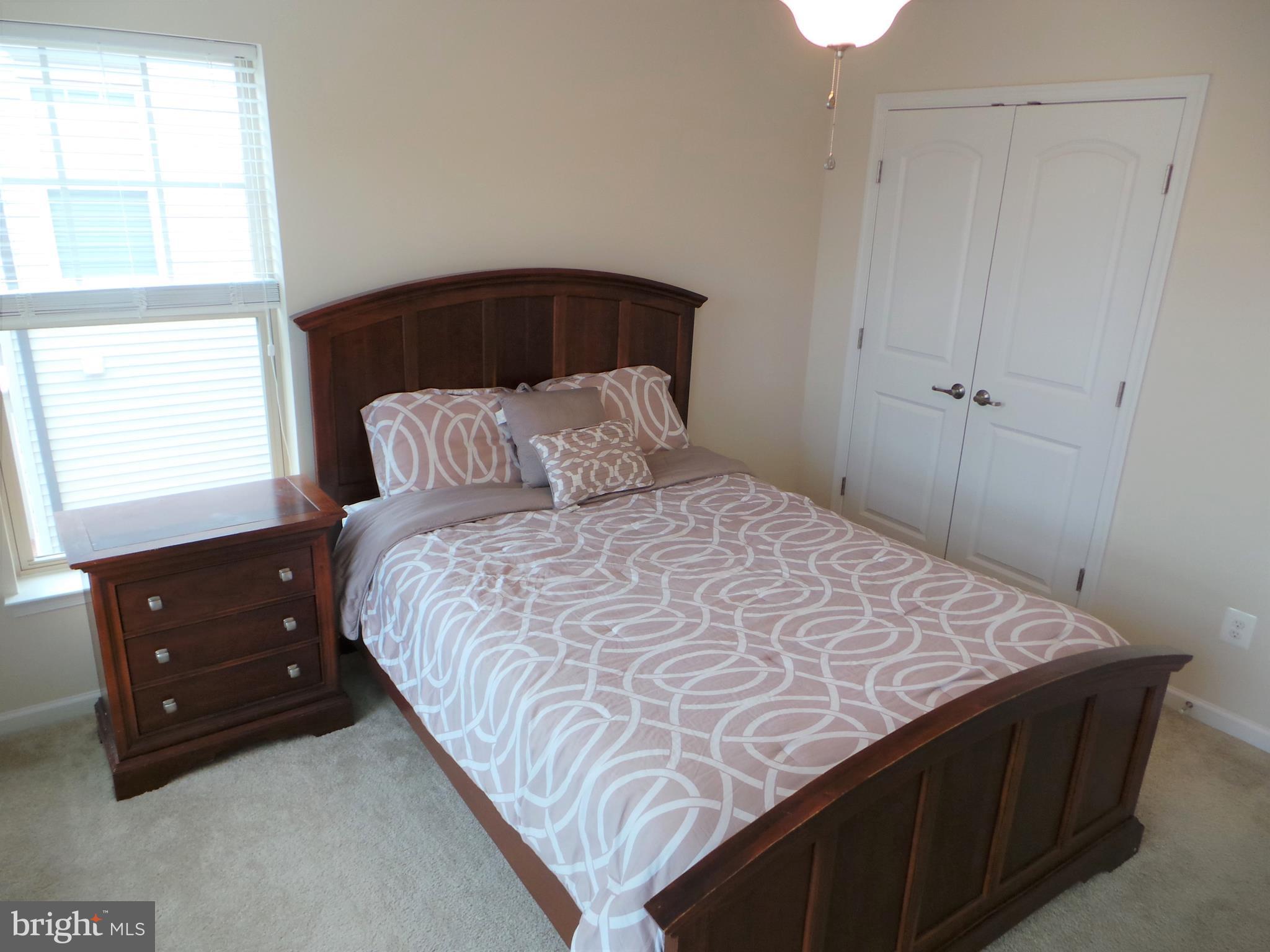 25278 Arrowroot Terrace Chantilly, VA 20152 - Photo 24 of 30 a bedroom with a bed and a window