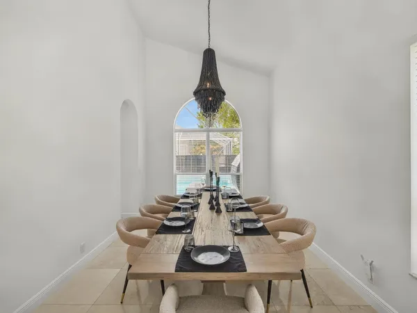 a view of a dining room with furniture and window