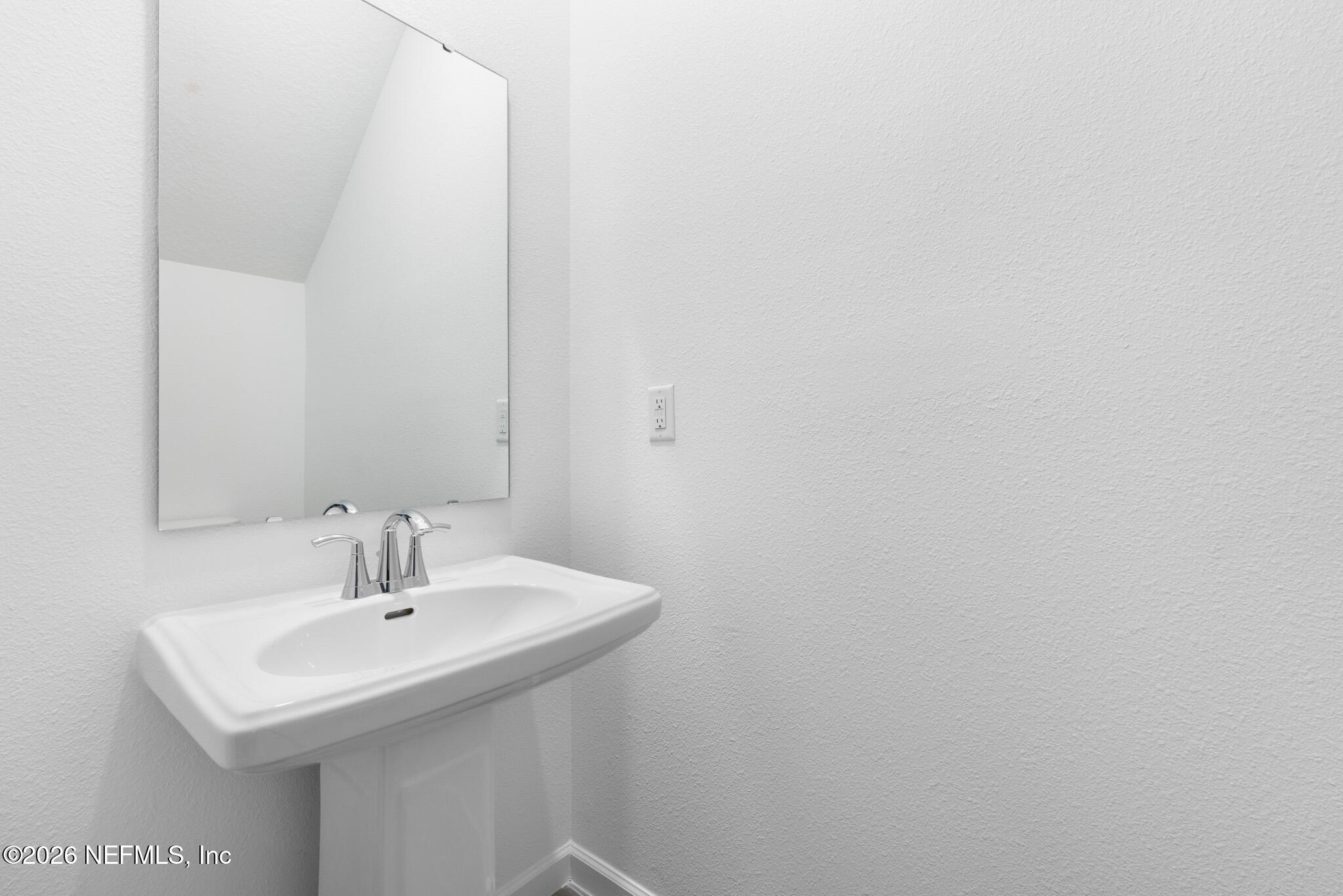 25 Craig Court St. Augustine, FL 32092 - Photo 11 of 25 a bathroom with a sink and a mirror