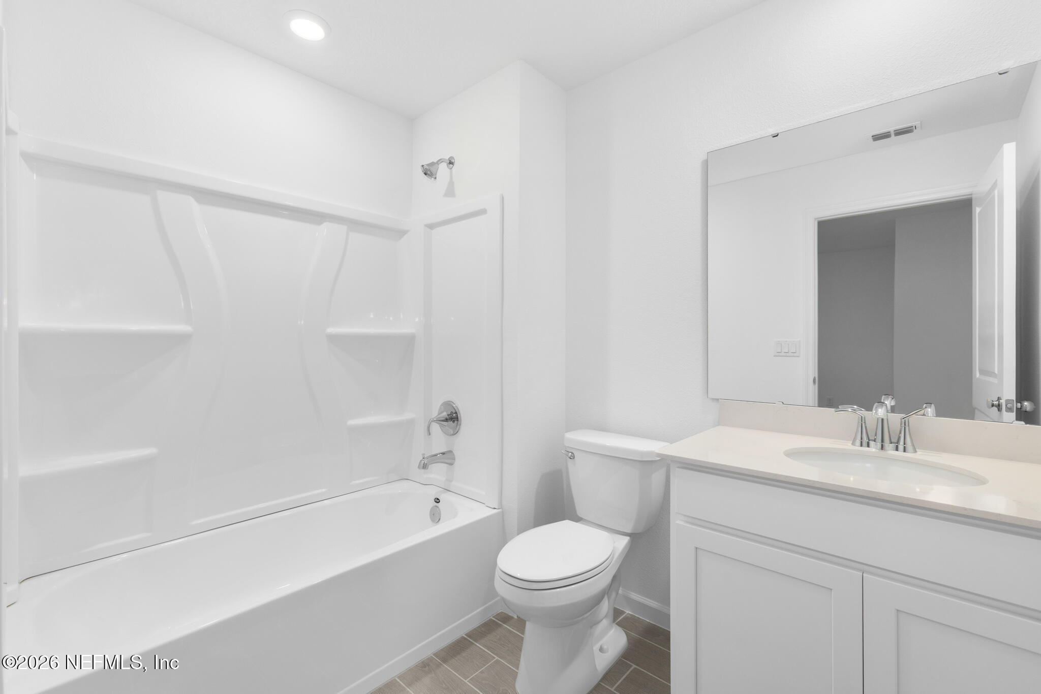 25 Craig Court St. Augustine, FL 32092 - Photo 14 of 25 a bathroom with a sink a toilet and a bathtub