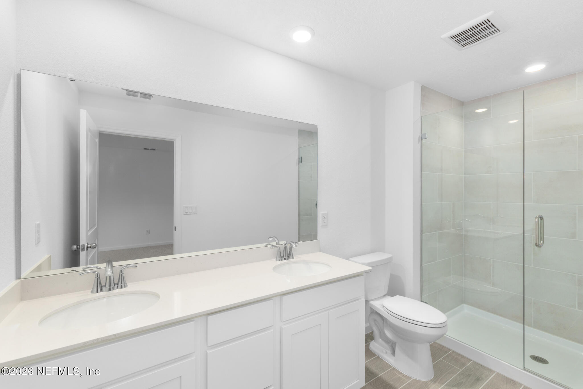 25 Craig Court St. Augustine, FL 32092 - Photo 23 of 25 a bathroom with a double vanity sink toilet and shower